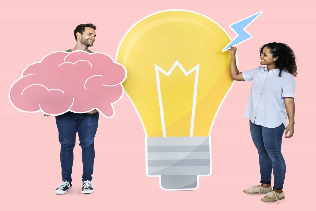 People holding images related to inspiration: a brain, a lightbulb, and a thunderbolt.