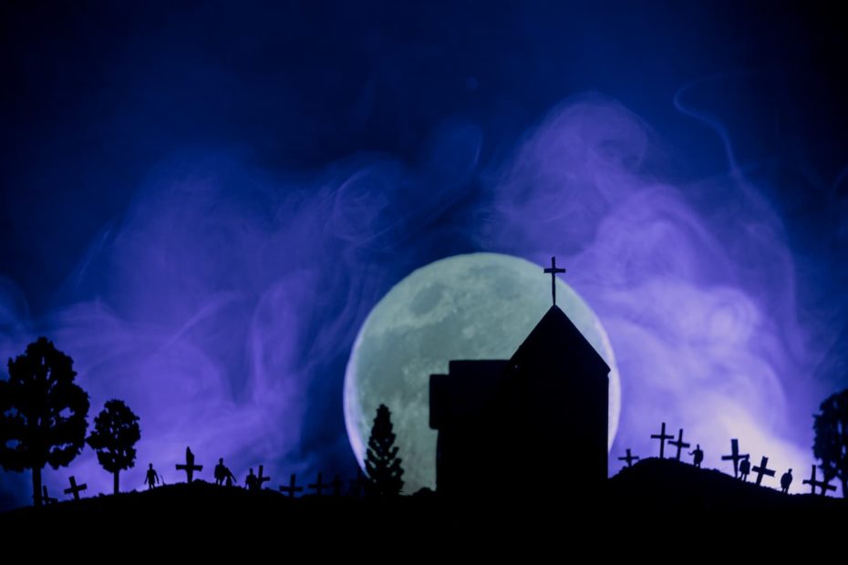 A drawing of spooky landscape with a purple sky and a full moon.