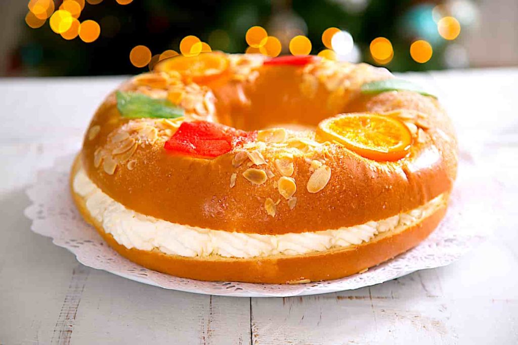 A Three Kings Cake, which is a crown shaped bread with colorful decorations.
