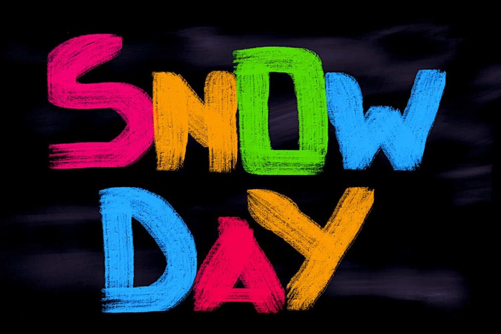 The words “Snow Day” written in bright colors on a chalkboard.
