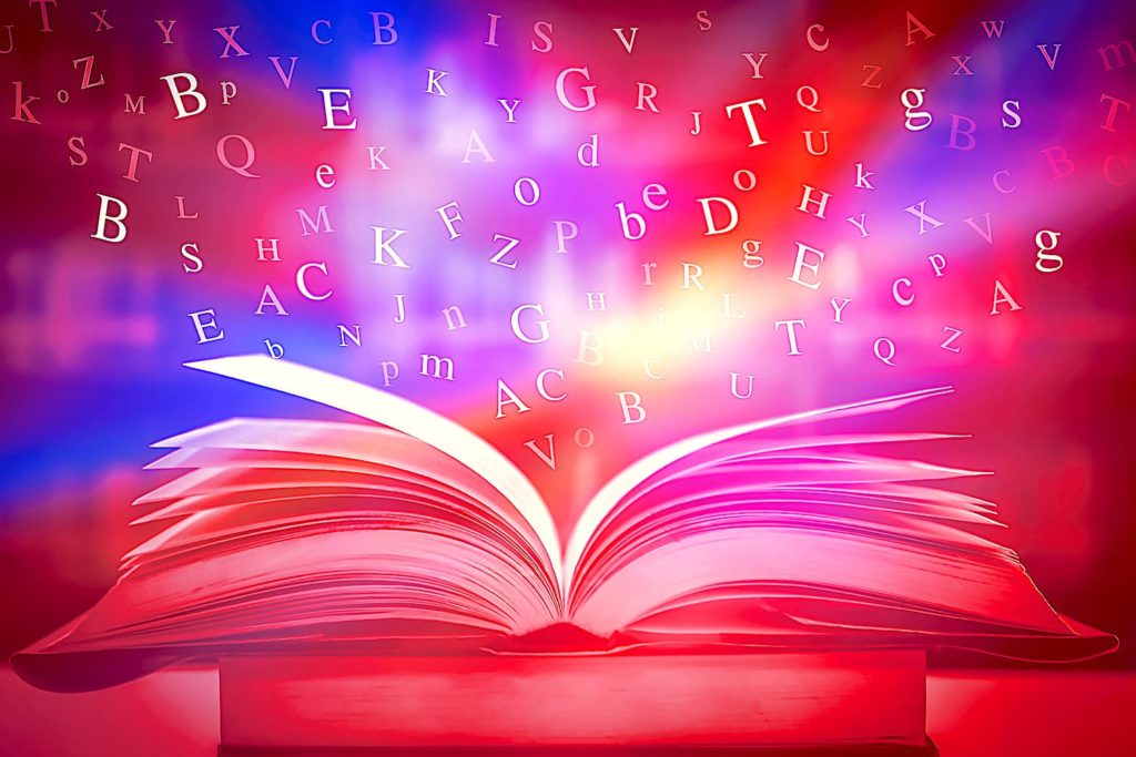 An image of an open book bursting with colorful lights.